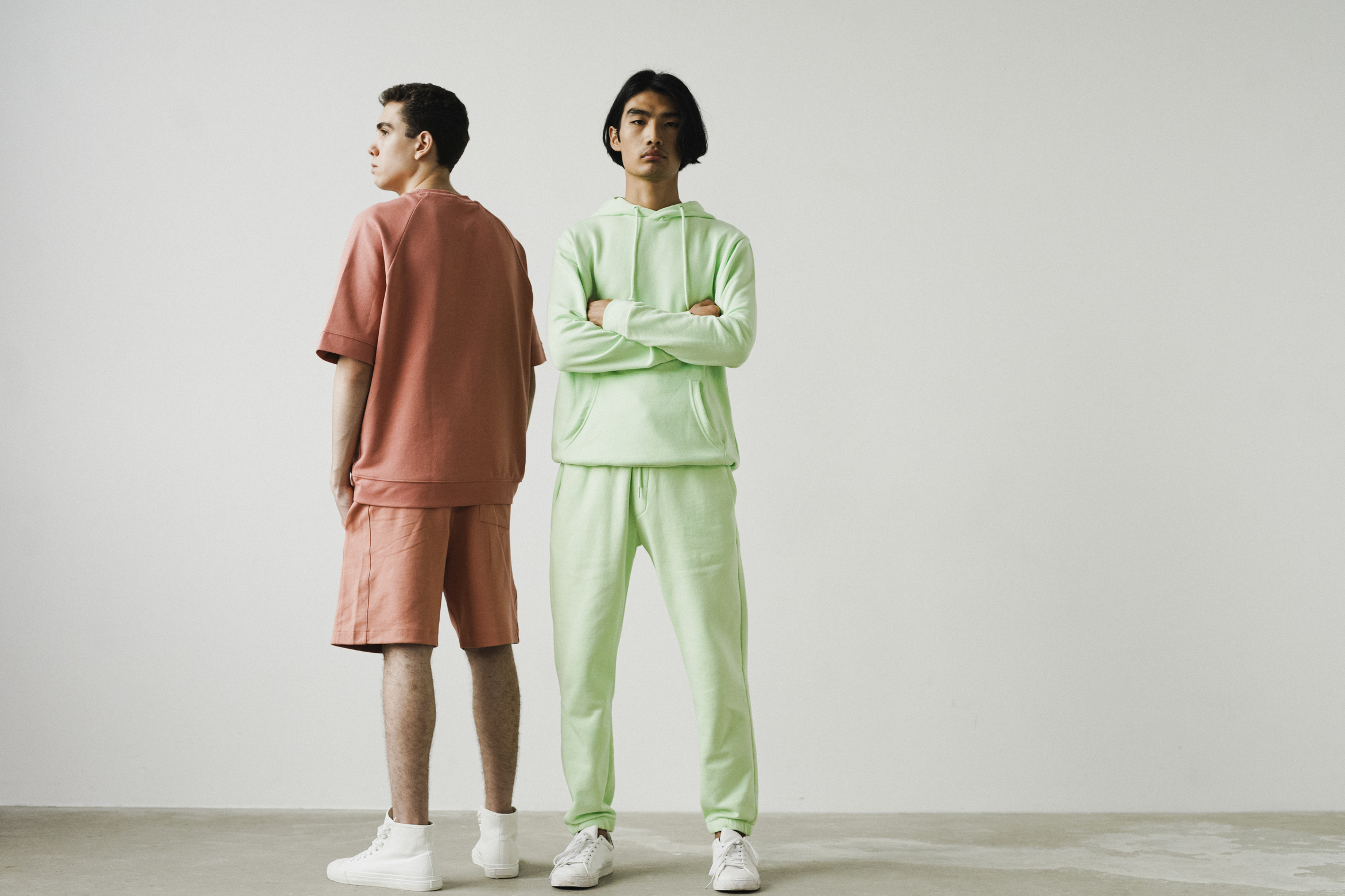 Men in Colored Clothes Standing  Together