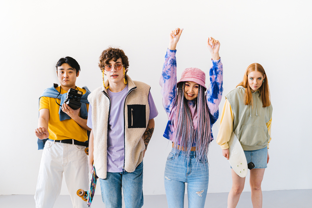 Photo of Men and Women in Fashionable Clothes