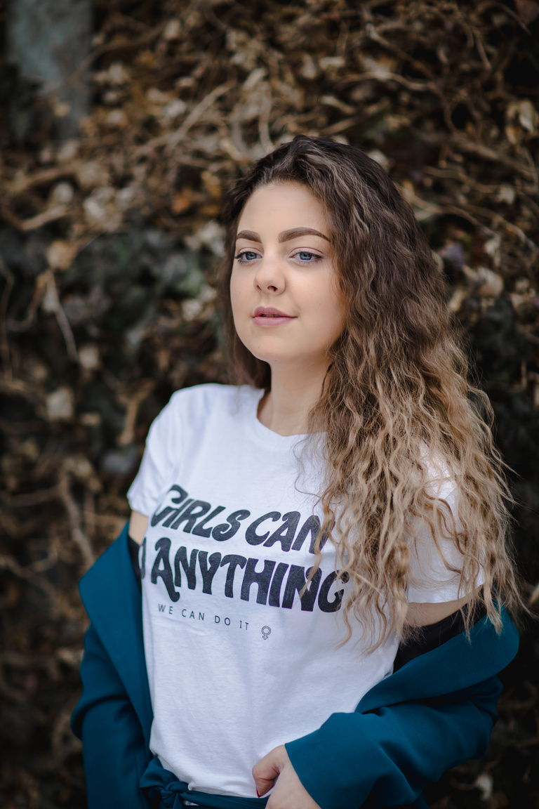 Shallow Focus Photography of Woman in White T-shirt and Blue Jacket